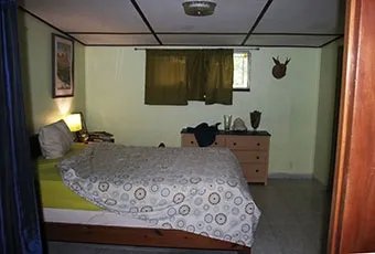 Corner lot for sale, just across the stree from the park in Llanos de Curundu